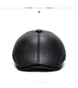 Front view of black faux leather flat cap showing detailed texture and premium stitching