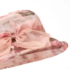 Elegant wide brim sun hat for women with organza floral bow detail and breathable lace