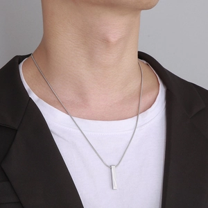 Minimalist silver titanium steel vertical bar pendant necklace shown on male model