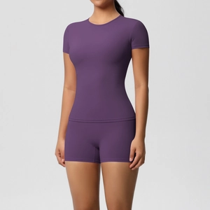 Detailed front view of high-stretch purple yoga set with slim fit t-shirt and shorts