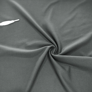 Detailed close-up of dark grey quick-dry mesh fabric showing breathable bird-eye texture