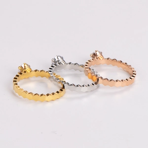 Detailed close-up of honeycomb rings in three colors with inlaid sparkling zircon stones