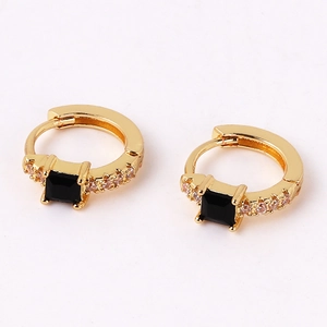 Detailed view of gold-plated square black gemstone earrings with sparkling accent stones