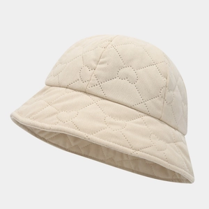 Beige corduroy bucket hat featuring minimalist heart quilted pattern for women and men
