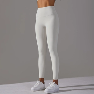 Detail view of high waisted white yoga leggings showing soft fabric and seamless contour