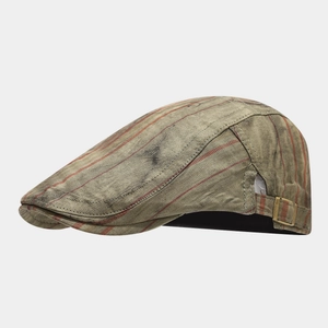 Detail view of washed cotton beret featuring vintage stripes and brass metal buckle