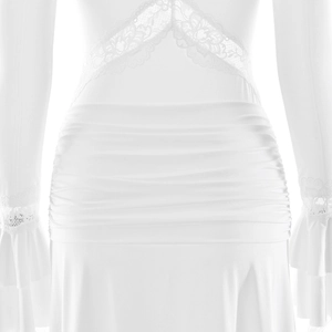 Detail of white slim dress showing waist pleats and elegant lace trim on the ruffles