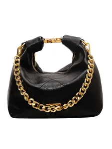 Quilted black leather bucket bag with chunky gold chain strap and metal buckle closure