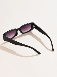 Detail view of rectangular sunglasses with black frame and purple gradient lenses