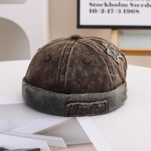 Vintage patchwork docker hat in washed cotton with star patch and brim detail