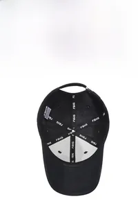 Detail shot of black baseball cap interior showing white FBXS lettered tape and stitching