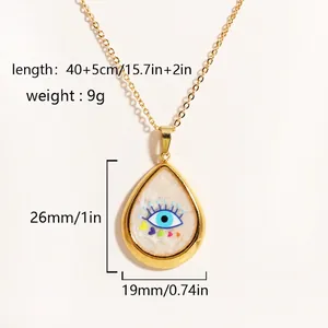 Detail of gold evil eye pendant showing dimensions 26x19mm and 40+5cm chain length