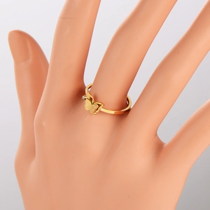 Golden butterfly ring with frosted wings and zircon accent on a model hand display