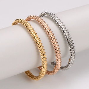 Three-piece set of rivet stud bracelets in gold, rose gold and silver stainless steel