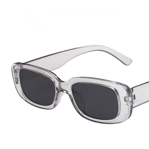 Retro square sunglasses with transparent grey frames and dark UV-protective lenses