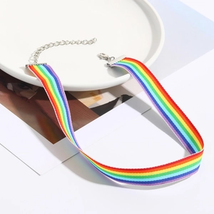 Detailed macro view of a colorful rainbow choker necklace with adjustable metal chain link