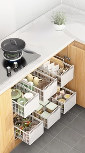 Macro view of pull-out white mesh kitchen storage basket for cabinet organization