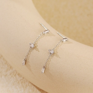 Close-up of S925 silver long tassel earrings with rectangular clear zircon drop accents