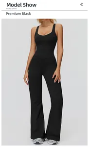 Front view of premium black brushed yoga jumpsuit featuring flared legs and slim fit design