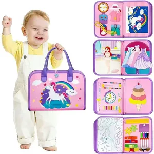 Detail of pink unicorn busy board featuring learning clock and interactive sensory buckles