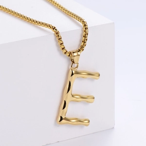 Polished 18K gold stainless steel letter E pendant necklace with molten lava texture