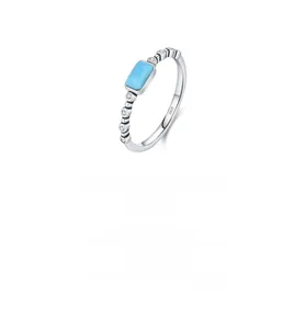 Macro detail of S925 sterling silver ring featuring a rectangular turquoise stone and zircon