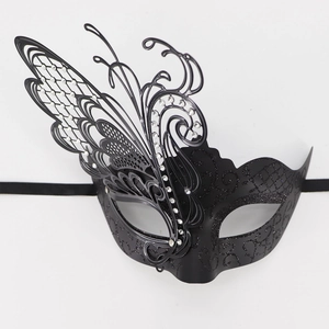 Detail of black butterfly masquerade mask with silver rhinestones and glittery finish