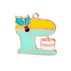 Detail of a teal and yellow enamel mixer pendant with gold plating and glitter