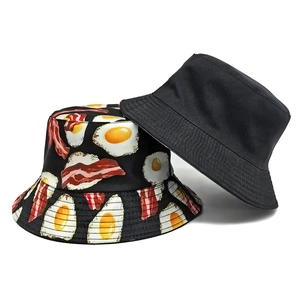 Unisex bucket hat with creative fried egg and bacon print and solid black outdoor sun hat