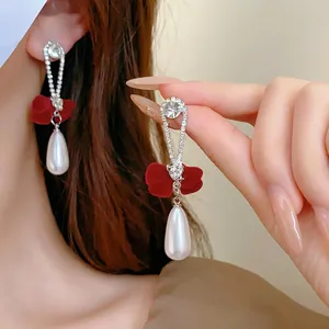 Elegant bow fringe pearl drop earrings with red velvet and sparkling rhinestones