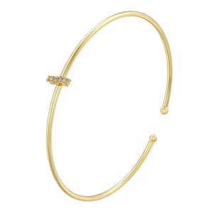 Detail of minimalist gold-plated bangle featuring a zircon-encrusted rectangular bar