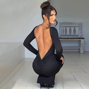 Detail view showing backless design and ruching of the black long-sleeve slim fit dress