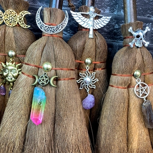 Handmade brown witch broomsticks with healing crystals and celestial charms for DIY decor