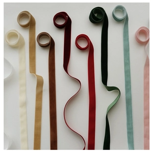 Close-up of assorted velvet ribbons in eight colors for DIY Christmas decorations