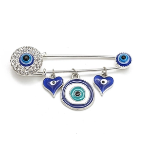 Detailed view of silver evil eye brooch with blue enamel hearts and crystals