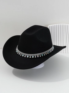Detail of western cowboy hat featuring silver metallic band with colorful gemstones