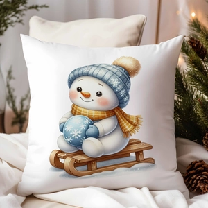 Détail de la housse de coussin bonhomme de neige sur tissu blanc avec décor festif