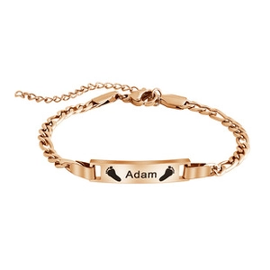 Detail of rose gold ID bracelet with engraved name Adam and baby footprints