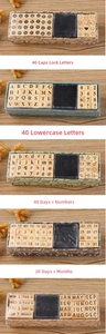 Close-up of wooden typewriter stamps set with letters, numbers and black ink pad