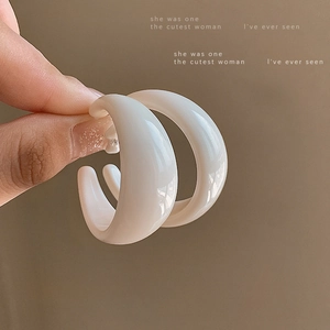 Retro milk white acrylic C-shape hoop earrings for women with high-end aesthetic