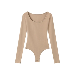 Detail shot of beige U-neck bodysuit featuring snap button closures and ribbed texture