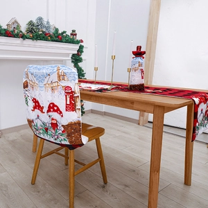 Festive Christmas table decor set with gnome patterns on chair covers and table runner
