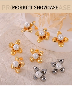 Detail of flower-shaped pearl earrings in gold and silver finish with silicone backs