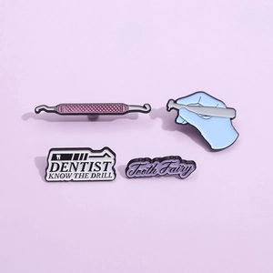 Set of four creative dentist enamel pins with dental tools and tooth fairy designs