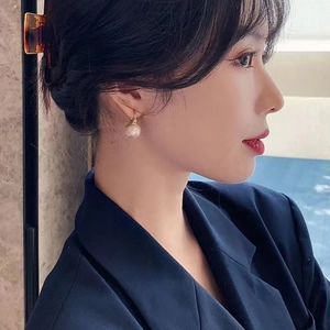 Elegant gold-plated pearl drop earrings for women with a minimalist luxury aesthetic