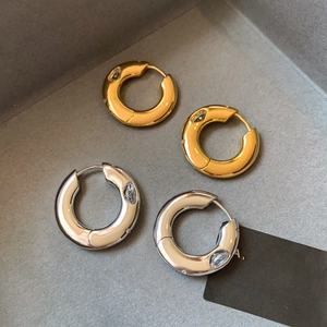 Elegant gold and silver plated hoop earrings with teardrop zircon in a display box