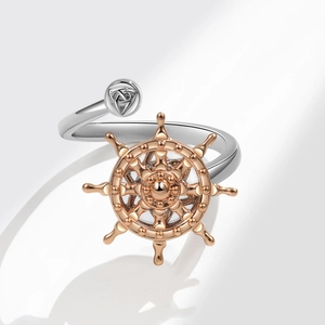 Rotating ship wheel and Celtic knot adjustable ring in silver and rose gold tones