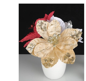 Close-up of golden sequined Christmas flower decoration in a minimalist white vase