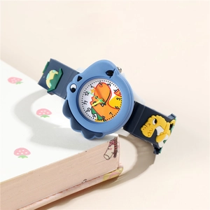 Detail view of cartoon dinosaur watch with 3D silicone strap and analog dial for kids