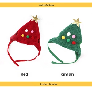 Close-up of red and green Christmas pet hats with plush pom-poms and gold stars
